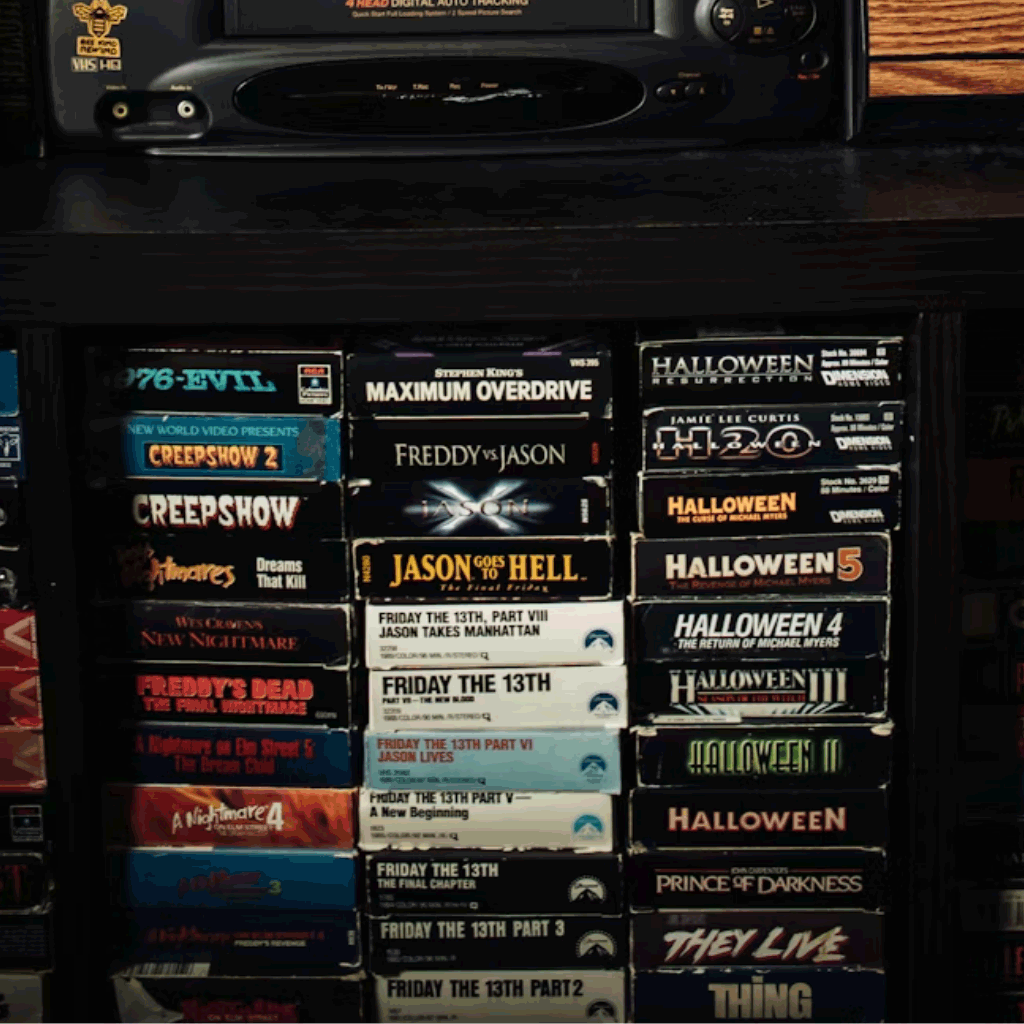 a selection of VHS tapes on a shelf